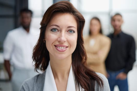 Portrait of a young business woman standing in the office
