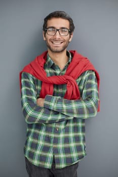 young unshaven business man posing against gray wall background studio portrait. Achieving career wealth business concept.