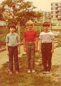 THE CZECHOSLOVAK SOCIALIST REPUBLIC - CIRCA 1980s: Retro photo shows pupils (boys) outdoors. They pose for a group photography. Color photo.