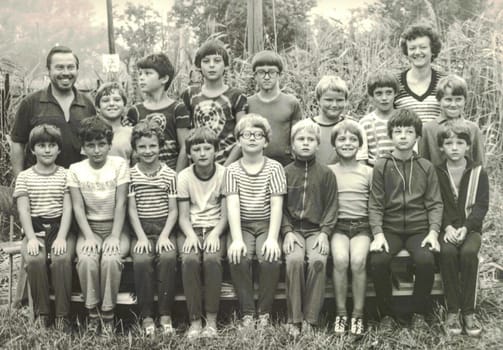 THE CZECHOSLOVAK SOCIALIST REPUBLIC - CIRCA 1980s: Retro photo of group of school pupils (young pioneers) with their teachers at summer camp. Black white photo