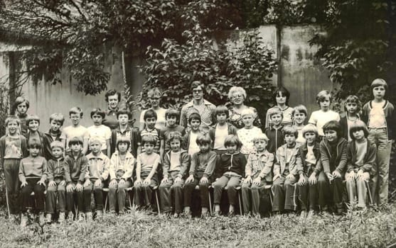 THE CZECHOSLOVAK SOCIALIST REPUBLIC - CIRCA 1980s: Retro photo of group of school pupils (young pioneers) with their teachers at summer camp. Black white photo