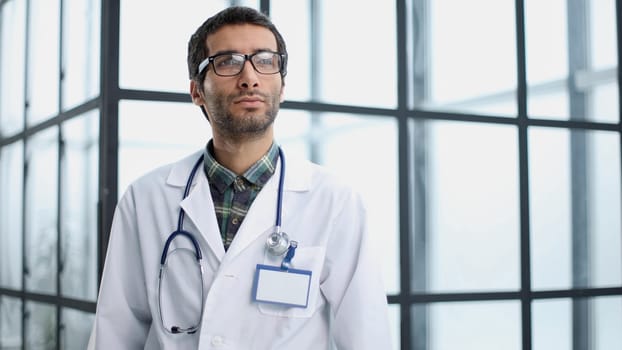 Portrait of young male nurse in hospital corridor