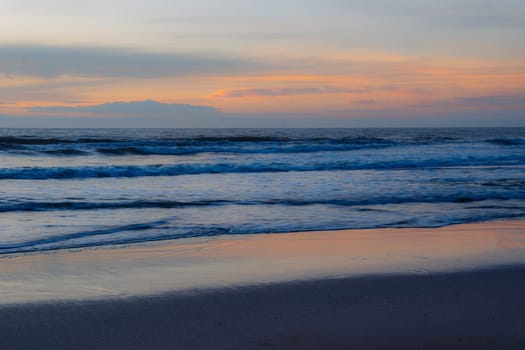 Beach in front of a sunset