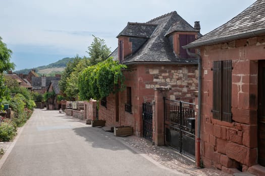 Collonges la Rouge, distinctive red brick houses and towers of the medieval Old Town, France. it is the first member of the Plus Beaux Villages de France nomination most beautiful villages of France