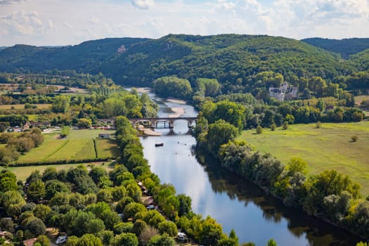 Beynac,france,04-09-2022:the camping beynac and the river dordogne with boats, seen from the castle high om the rock of beynac