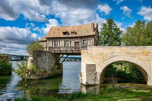 Old timbered water mill house on bridge seine river, vernon, normandy, france, europe