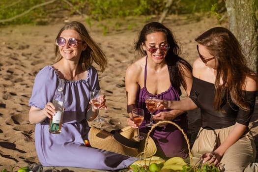 Friends having fun at beach on sunny day. Party time. Summer holidays vacation happy people concept. Three young feFriends having fun at beach on sunny day.