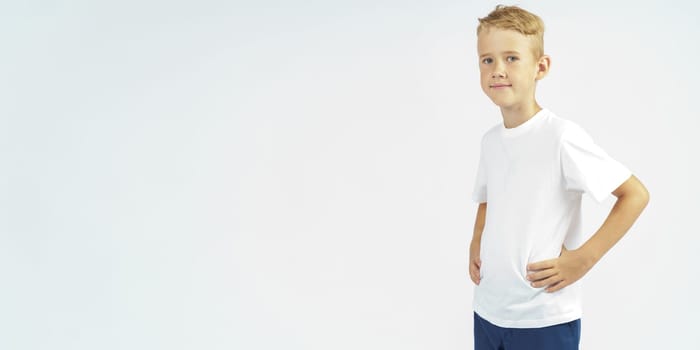 Portrait of a schoolboy looking at the camera. Isolated background. Education concept.