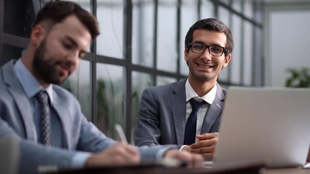 Collaboration, teamwork and meeting at desk for creative vision, innovation or idea late at work