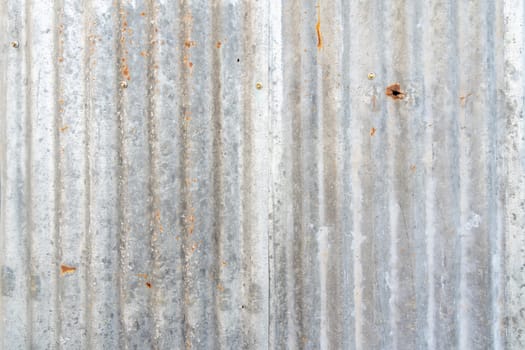 Rusty zinc sheet texture and background, Reddish brown stain on metallic silver