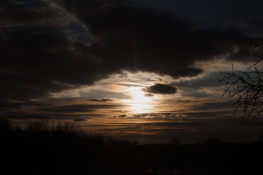 Natural sunset or sunrise. Bright dramatic Sky. Countryside Landscape under Scenic Colorful Sky at Sunset. Sun over skyline, Horizon