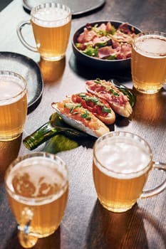 Close up view of food and beer on the table.