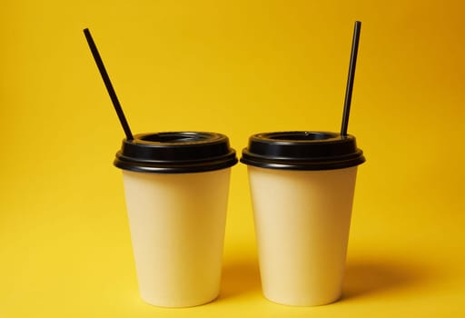 Paper Coffee Container with Black Lid on Yellow Background White Coffee Paper Cup with Black Lid on Yellow Background Takeaway Coffee