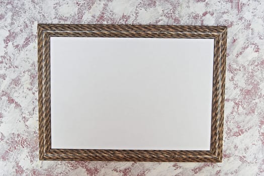 photo frame with a brown pattern on a light spotted background