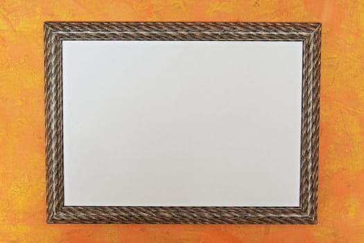 wooden photo frame with a white image on a bright orange background