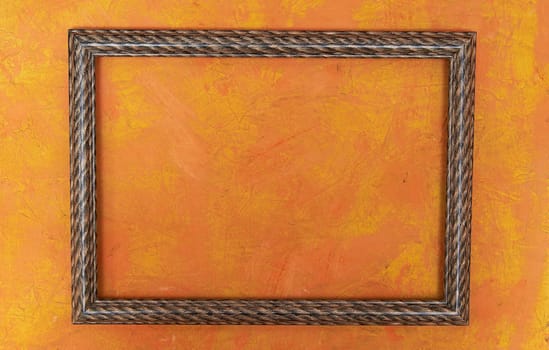 wooden photo frame on bright orange background