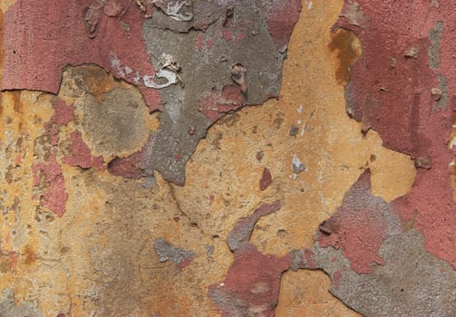 Old concrete wall with crumbling paint and yellow paint, backgrounds, textures