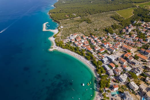 View from a height of the resort tourist town near the Adriatic Sea. Rocky mountains and pine forest.