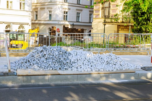 A pile of European square white paving stones at a construction site in Prague, Czech Republic. Construction of sidewalks.