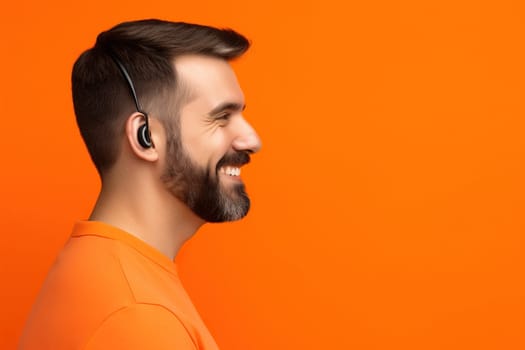Caucasian young bearded man wearing small sportive headset in orange t-shirt isolated at orange background, closeup portrait, AI generative image, lot of copy space