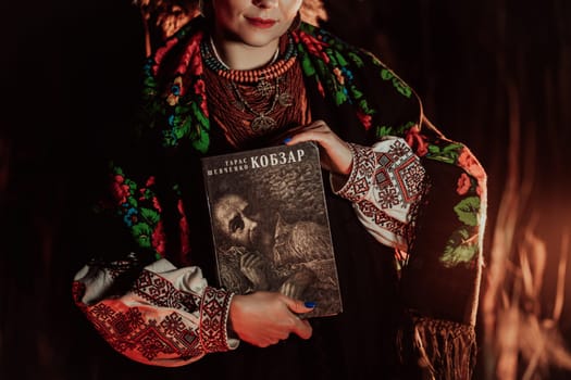 Woman holding Kobzar - poetry book collection of Taras Shevchenko - poet, bard in Ukrainian culture.