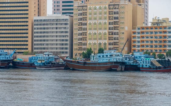 Frieght and cargo dhows docked on the Deira waterfront in Dubai seen across the creek from Bur Dubai