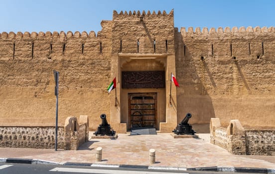 Entrance to the old fortress housing the museum in Bur Dubai with cannons