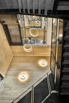 the inside of a building that looks like it's going through a hole in the floor to another room