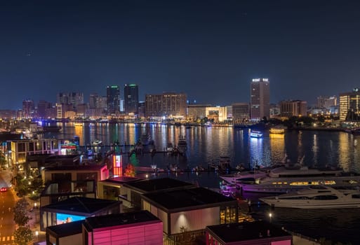 Dubai, UAE - 31 March 2023: View down the Creek towards Deira as tour boats pass along the water