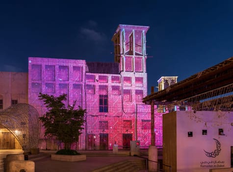 Dubai, UAE - 30 March 2023: Buildings in the Old city of Dubai illuminated for the evening in Ramadan