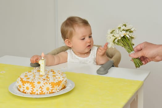 Yellow cake with daisy flowers chamomile for birthday