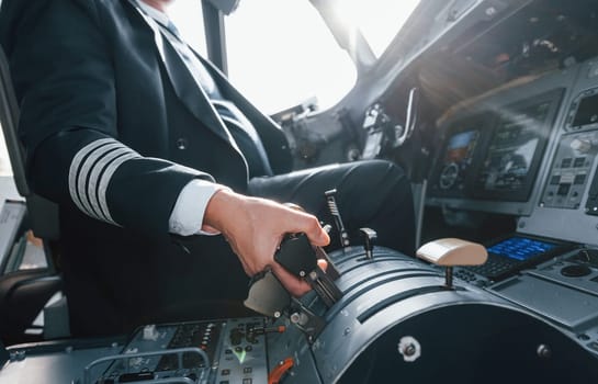 A professional pilot is in the cockpit. Conception of work.