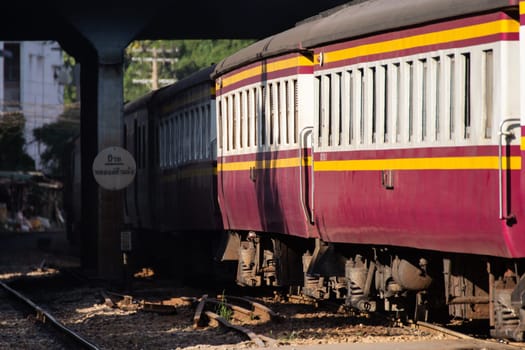 Bangkok, Thailand - November 14, 2016 : Unidentified railway train on the railroad tracks in Bangkok station. Many people in Thailand popular travel by train because it is cheaper.