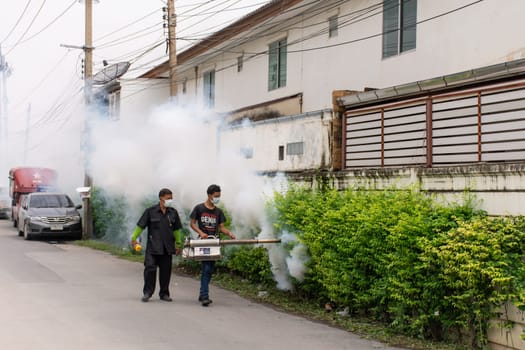 Bangkok, Thailand - July 3, 2016 : Unidentified people fogging DDT spray for mosquito kill and protect by control mosquito is a carrier of Malaria, Encephalitis, Dengue and Zika virus in village.