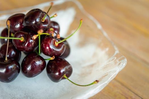 Cherry, Cherry Tree or Cherrywood on a wood table is fresh berry fruit and sweet juicy for sale at Thai street food and fruit market in concept food and fruit, healthy eating in life