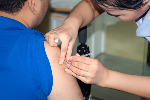 Patient asian woman health check by get vaccinated against the flu covid19 or corona virus every year by the Ministry of Health at hospital in concept illness, outbreak, healthcare in life