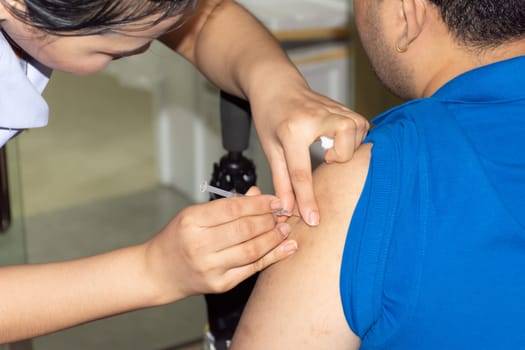 Patient asian woman health check by get vaccinated against the flu covid19 or corona virus every year by the Ministry of Health at hospital in concept illness, outbreak, healthcare in life