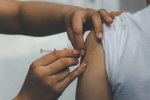 Patient asian woman health check by get vaccinated against the flu covid19 or corona virus every year by the Ministry of Health at hospital in concept illness, outbreak, healthcare in life