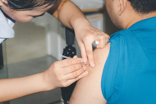 Patient asian woman health check by get vaccinated against the flu covid19 or corona virus every year by the Ministry of Health at hospital in concept illness, outbreak, healthcare in life