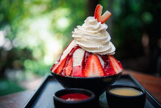 Bingsu or Bingsoo (Patbingsu) is a popular Korean shaved ice dessert with sweet toppings that may include chopped fruit, condensed milk, fruit syrup, and varieties with ingredients