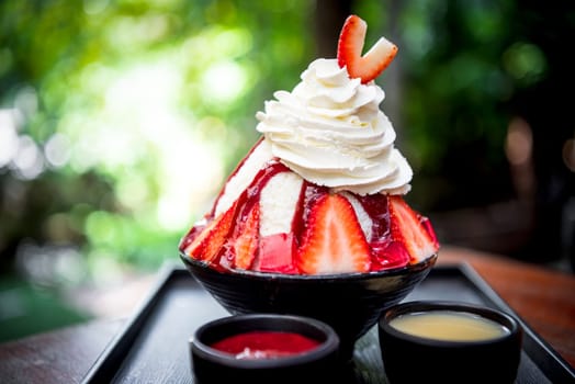 Bingsu or Bingsoo (Patbingsu) is a popular Korean shaved ice dessert with sweet toppings that may include chopped fruit, condensed milk, fruit syrup, and varieties with ingredients