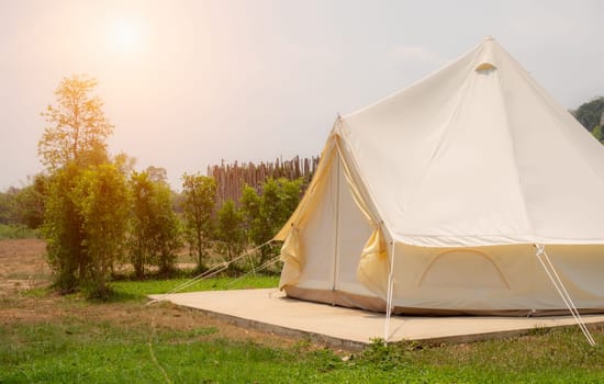 Camping picnic tent campground in outdoor hiking forest. Camper while campsite in nature background at summer trip camp. Adventure Travel Vacation concept