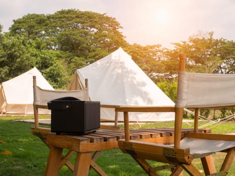 Camping picnic tent campground in outdoor hiking forest. Camper while campsite in nature background at summer trip camp. Adventure Travel Vacation concept
