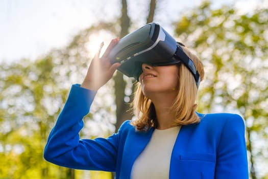 Woman with VR virtual reality goggles experiences a metaverse world. Augmented reality technology concept