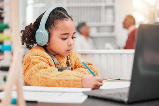 Headphones, elearning and kid writing in home for online class, homeschool and homework. Laptop, education and development of girl studying, distance learning and knowledge, notes and growth in house.