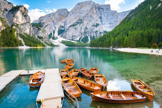 Boats on the Lake Braies in Dolomites mountains, Italy. Picturesque Italian landscape.