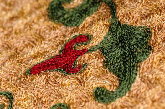 A closeup shot of national ornaments and patterns of Central Asia on a piece of fabric