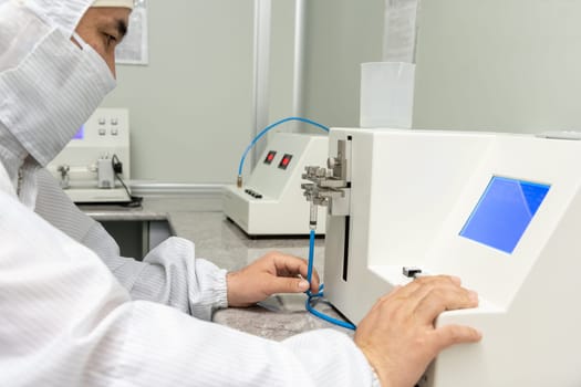 The workers in the workshop for the production and quality control of the internal parts of medical syringes