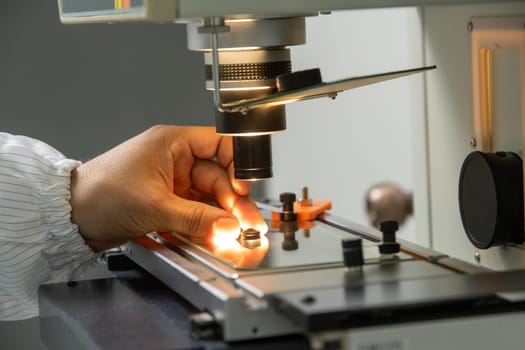 A closeup of the production and quality control of the internal parts of medical syringes