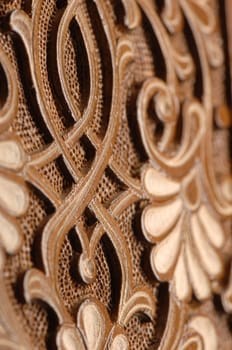A close-up of vintage oriental artistic wood carving. Central Asia, Uzbekistan